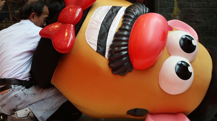 Workers inspect a Mr Potato Head figure from Toy Story which is part of a Chinese New Year promotional event at The One, Tsim Sha Tsui. 05JAN12 (Photo by Nora Tam/South China Morning Post via Getty Images)