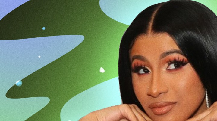 Cardi B posing with hands on chin.