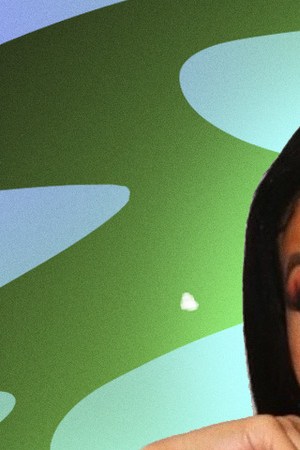 Cardi B posing with hands on chin.