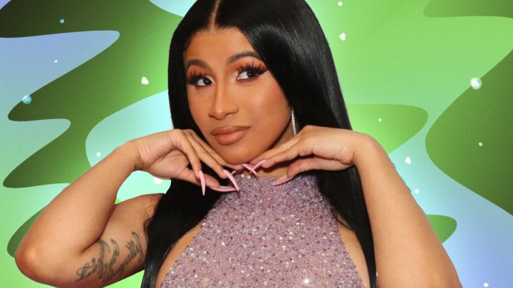 Cardi B posing with hands on chin.