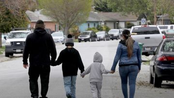 hristian (left) and his wife Monze (right) were laid off from restaurant jobs in mid-March and not qualified to receive unemployment because they are undocumented immigrants as they walk with their 9 and 4 year old sons on Thursday, April 9, 2020, in San Lorenzo, Calif. Liz Hafalia/The San Francisco Chronicle via Getty Images