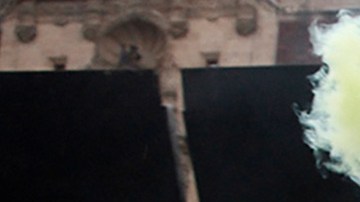 A woman, takes part during a performance of Feminist groups, to write names of victims of femicide and place flowers in protest against gender violence, as part of the protests of International Women's Day at the National Palace on March 7, 2021 in Mexico City, Mexico. Photo credit Luis Barron / Eyepix Group/Barcroft Media via Getty Images
