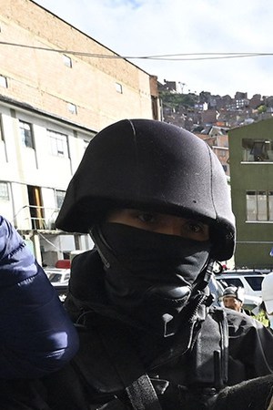 Former interim Bolivia's President Jeannine Anez (C) is escorted by police members of the Special Force against Crime (FELCC) after being arrested in La Paz, on March 13, 2021. Photo by AIZAR RALDES/AFP via Getty Images