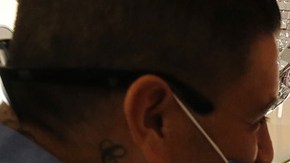 Janie Isidoro, owner of My Corazon, a Chicano business in downtown Hanford, CA helps Carlos Garcia, left. Al Seib / Los Angeles Times