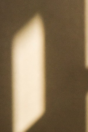 A graduate paces in the sun streaked lobby of the Civic Building before the Montgomery branch of the Latin American Youth Center (LAYC), the DC non-profit, holds its graduation ceremony for its GED students, on May, 25, 2016 in Silver Spring, MD. Photo by Bill O'Leary/The Washington Post via Getty Images.