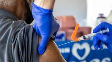 RN Melanie Albor vaccinates a resident at an affordable housing community on Thursday, Feb. 25, 2021 in Tracy, CA. Brian van der Brug / Los Angeles Times via Getty Images