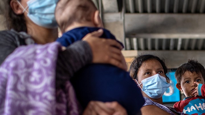 Central American asylum seekers arrive to a bus station after being released by U.S. Border Patrol agents on February 26, 2021 in Brownsville, Texas. U.S. immigration authorities are now releasing many asylum seeking families after they cross the U.S.-Mexico border and are taken into custody. Photo by John Moore/Getty Images