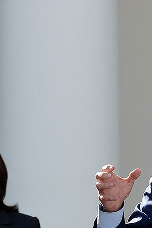 US President Joe Biden, with Vice President Kamala Harris (L) and Senate Majority Leader Chuck Schumer, Democrat of New York, speaks about the American Rescue Plan in the Rose Garden of the White House in Washington, DC, on March 12, 2021. Photo by OLIVIER DOULIERY/AFP via Getty Images