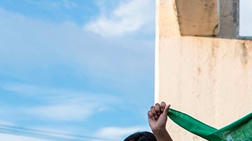 Activists raise green headscarves during a demonstration demanding the legalisation of abortion at the Constitution Square in the framework of the International Safe Abortion Day in San Salvador, on September 28, 2020. Photo by YURI CORTEZ/AFP via Getty Images