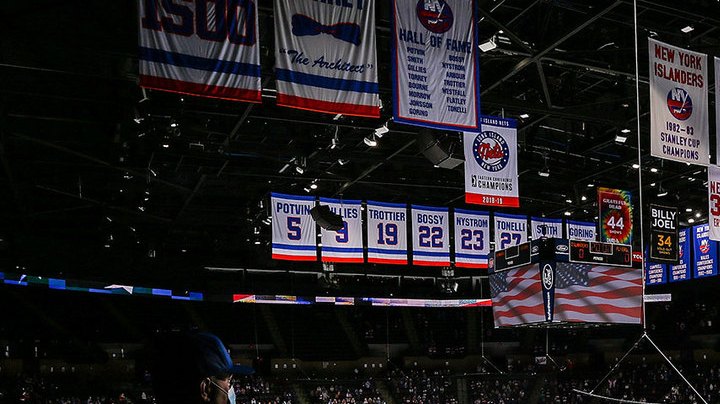 New York Islanders and the Philadelphia Flyers stand during the National Anthem at Nassau Coliseum on March 18, 2021 in Uniondale, New York. Philadelphia Flyers defeated the New York Islanders 4-3. Photo by Mike Stobe/NHLI via Getty Images