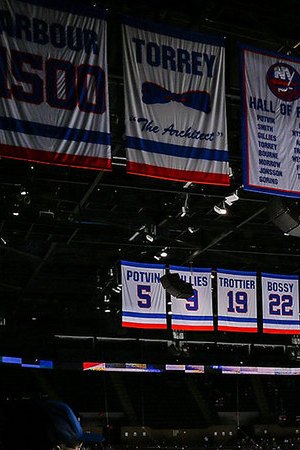 New York Islanders and the Philadelphia Flyers stand during the National Anthem at Nassau Coliseum on March 18, 2021 in Uniondale, New York. Philadelphia Flyers defeated the New York Islanders 4-3. Photo by Mike Stobe/NHLI via Getty Images