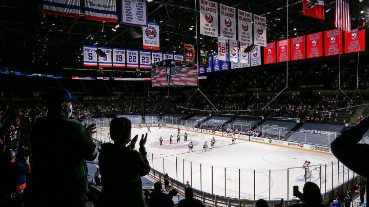New York Islanders and the Philadelphia Flyers stand during the National Anthem at Nassau Coliseum on March 18, 2021 in Uniondale, New York. Philadelphia Flyers defeated the New York Islanders 4-3. Photo by Mike Stobe/NHLI via Getty Images
