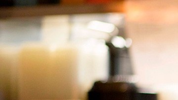 A cook at Arnaldo Richards' Picos wears gloves and a mask while cooking orders amid the coronavirus pandemic May 1, 2020 in Houston, Texas. Photo by MARK FELIX/AFP /AFP via Getty Images