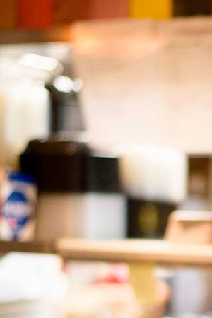 A cook at Arnaldo Richards' Picos wears gloves and a mask while cooking orders amid the coronavirus pandemic May 1, 2020 in Houston, Texas. Photo by MARK FELIX/AFP /AFP via Getty Images