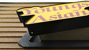 Jesus Estrella holds a sign of solidarity outside Youngs Asian Massage where four people were shot and killed on March 17, 2021 in Acworth, Georgia. Photo by Elijah Nouvelage/Getty Images