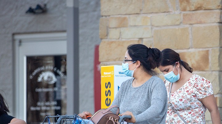 Customers leave Walmart on March 3, 2021 in Austin, Texas. Gov. Greg Abbott announced today that the state will end its mask mandate and allow businesses to reopen at 100 percent capacity on March 10. Photo by Montinique Monroe/Getty Images