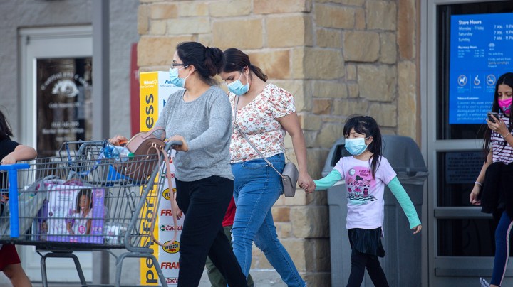 Customers leave Walmart on March 3, 2021 in Austin, Texas. Gov. Greg Abbott announced today that the state will end its mask mandate and allow businesses to reopen at 100 percent capacity on March 10. Photo by Montinique Monroe/Getty Images
