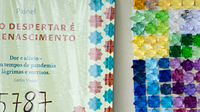 People wait to receive a dose of coronavirus (COVID-19) vaccination in front of the panel in honor of the fatal victims of the disease amidst the coronavirus pandemic in Centro de Saúde 07, on March 29, 2021 in Brasilia Ceilândia, Brazil. Photo by Andressa Anholete / Getty Images