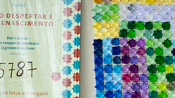 People wait to receive a dose of coronavirus (COVID-19) vaccination in front of the panel in honor of the fatal victims of the disease amidst the coronavirus pandemic in Centro de Saúde 07, on March 29, 2021 in Brasilia Ceilândia, Brazil. Photo by Andressa Anholete / Getty Images