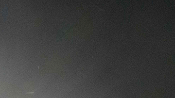 Women and children immigrants who arrived illegally across the Rio Grande river from Mexico rest on March 27, 2021 at a makeshift processing checkpoint before being detained at a holding facility by border patrol agents in the border city of Roma. Photo by Ed JONES / AFP.