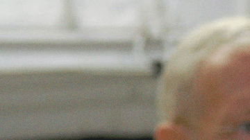 In the White Room on NASA Kennedy Space Center's Launch Pad 39A, STS-128 Mission Specialist Jose Hernandez waits his turn to enter space shuttle Discovery. In the background are Mission Specialists Patrick Forrester (left) and Christer Fuglesang (back to camera). Photo credit: NASA/Jim Grossmann