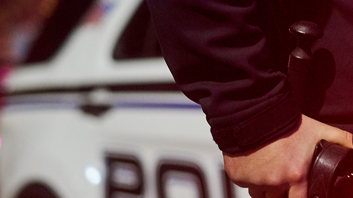 Closeup shot of an unrecognizable policeman out on patrol. Photo by PeopleImages/Getty Images