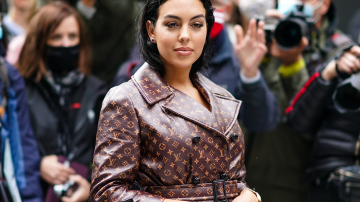 Georgina Rodriguez wears a brown leather Vuitton monogram print trench coat, outside Louis Vuitton, during Paris Fashion Week - Womenswear Spring Summer 2021, on October 06, 2020 in Paris, France. Photo by Edward Berthelot/Getty Images