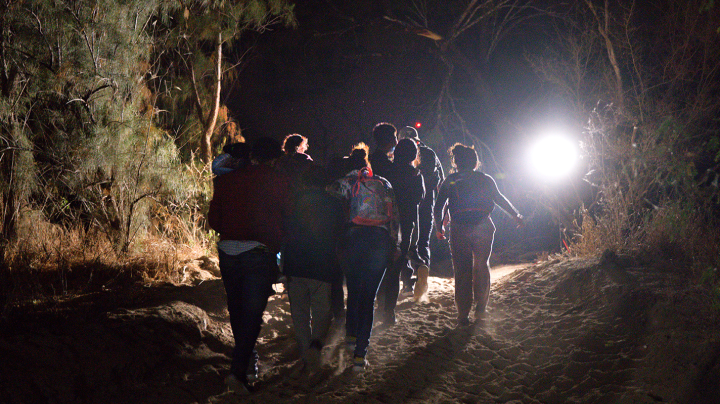 Immigrant walk up from the bank of the Rio Grande after being smuggled into the United States on April 15, 2021 in Roma, Texas. Photo by John Moore/Getty Images