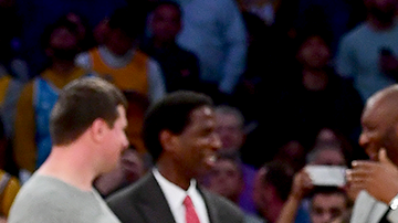 Kobe Bryant poses with his family at halftime after both his #8 and #24 Los Angeles Lakers jerseys are retired at Staples Center on December 18, 2017 in Los Angeles, California. Photo by Harry How/Getty Images