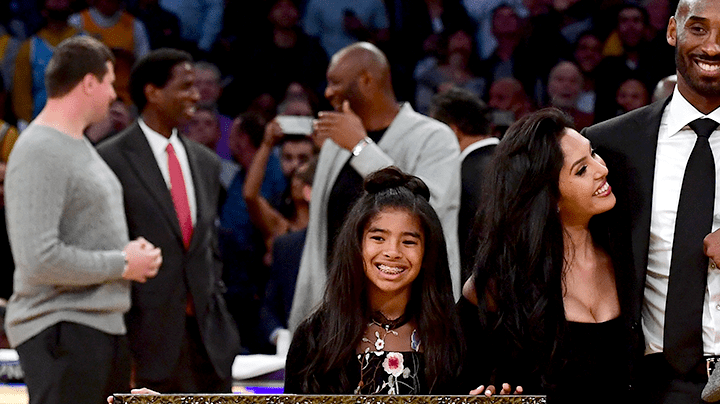 Kobe Bryant poses with his family at halftime after both his #8 and #24 Los Angeles Lakers jerseys are retired at Staples Center on December 18, 2017 in Los Angeles, California. Photo by Harry How/Getty Images