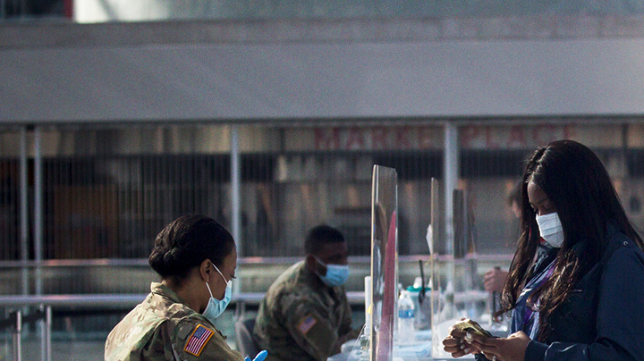 Members of the National Guard check people in at a COVID-19 vaccination site at the Javits Center in New York, United States, April 6, 2021. U.S. Xinhua/Michael Nagle via Getty Images