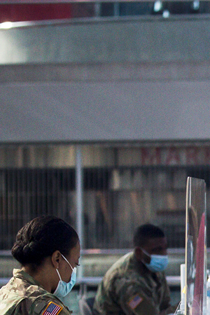 Members of the National Guard check people in at a COVID-19 vaccination site at the Javits Center in New York, United States, April 6, 2021. U.S. Xinhua/Michael Nagle via Getty Images