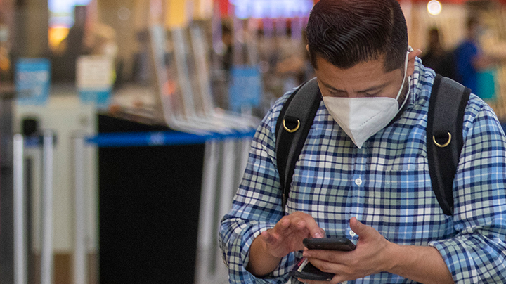 A traveler waits in line at LAX on Friday, April 2, 2021 in Los Angeles, CA. Francine Orr/ Los Angeles Times via Getty Images