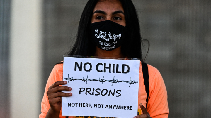 Demonstrators protest around the Homestead Detention Center, demanding the center's closure, the end to deportation of immigrants and the detention of immigrant children in Homestead, Florida on April 10, 2021. Photo by CHANDAN KHANNA/AFP via Getty Images
