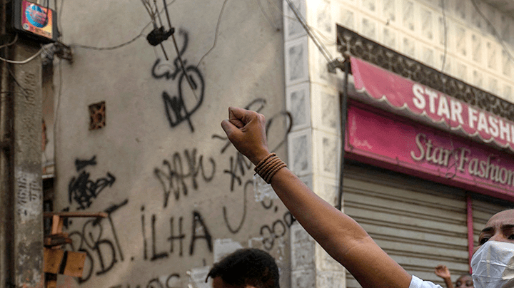Residentes protest after a police operation against alleged drug traffickers at the Jacarezinho favela in Rio de Janeiro, Brazil, on May 06, 2021. Photo by MAURO PIMENTEL/AFP via Getty Images