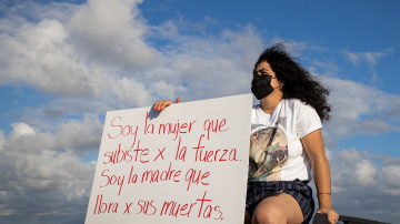 People gather at the Teodoro Moscoso bridge in order to protest and demand justice for the most recent feminiced against Keishla Rodríguez and Andrea Ruiz Costas, in San Juan, Puerto Rico, on May 2, 2021. Photo by Alejandro Granadillo/NurPhoto via Getty Images