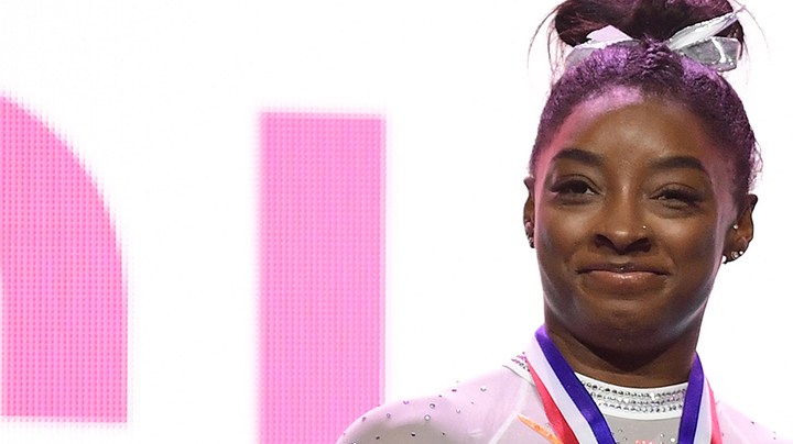 Simone Biles smiles after being announced as the overall winner of the 2021 GK U.S. Photo by Emilee Chinn/Getty Images
