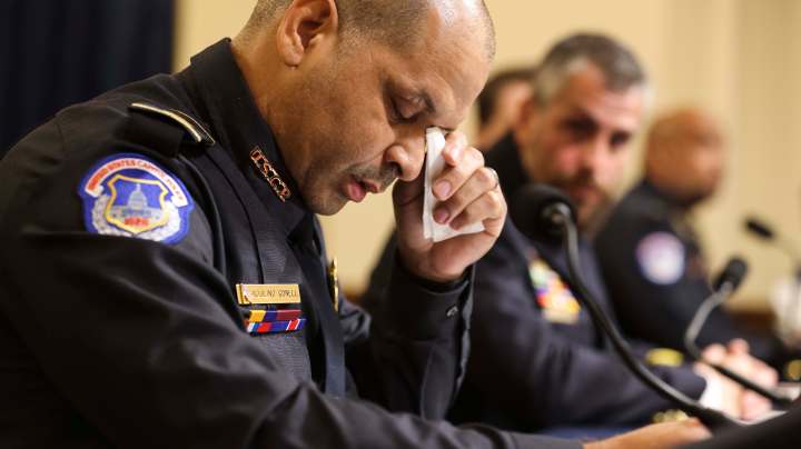 WASHINGTON, DC - JULY 27: U.S. Capitol Police officer Sgt. Aquilino Gonell becomes emotional as he testifies before the House Select Committee investigating the January 6 attack on the U.S. Capitol on July 27, 2021 at the Cannon House Office Building in Washington, DC. Members of law enforcement testified about the attack by supporters of former President Donald Trump on the U.S. Capitol. According to authorities, about 140 police officers were injured when they were trampled, had objects thrown at them, and sprayed with chemical irritants during the insurrection. (Photo by Oliver Contreras-Pool/Getty Images)