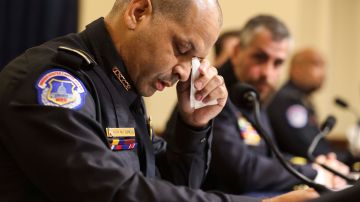 WASHINGTON, DC - JULY 27: U.S. Capitol Police officer Sgt. Aquilino Gonell becomes emotional as he testifies before the House Select Committee investigating the January 6 attack on the U.S. Capitol on July 27, 2021 at the Cannon House Office Building in Washington, DC. Members of law enforcement testified about the attack by supporters of former President Donald Trump on the U.S. Capitol. According to authorities, about 140 police officers were injured when they were trampled, had objects thrown at them, and sprayed with chemical irritants during the insurrection. (Photo by Oliver Contreras-Pool/Getty Images)
