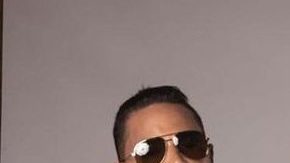 Bad Bunny and Aventura posing together.