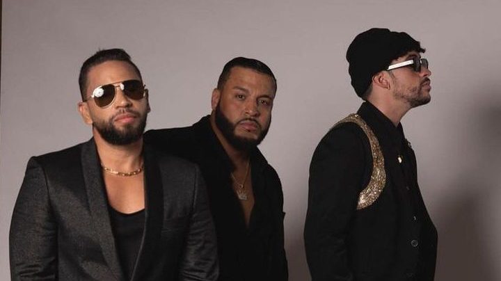 Bad Bunny and Aventura posing together.