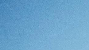 Senior woman swimming in bay on summer evening