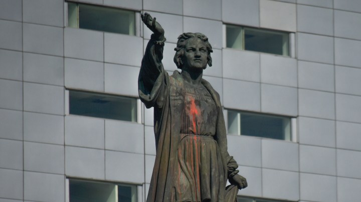 Christopher Columbus statue painted red.