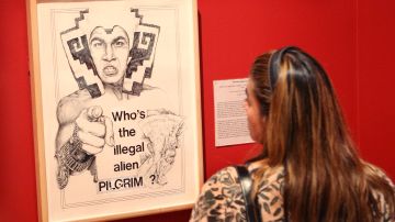 CHICAGO - JULY 09:  A visitor views "Who's the Illegal Alien Pilgrim?" a drawing by Yolanda Lopez in the National Museum of Mexican Art July 9, 2008 in Chicago, Illinois. The piece is part of the exhibit called A Declaration of Immigration which features the works of over 70 artists depicting the experiences and viewpoints of the U.S. immigrant communities. The show is scheduled to run through October 2, 2008.  (Photo by Scott Olson/Getty Images)