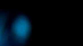 African-American couple wearing protective face masks while watching a movie at the cinema and enjoying.