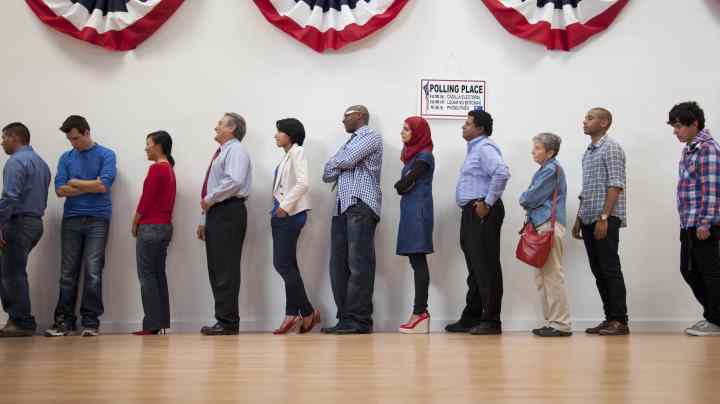 Voters waiting to vote in polling place