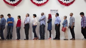 Voters waiting to vote in polling place