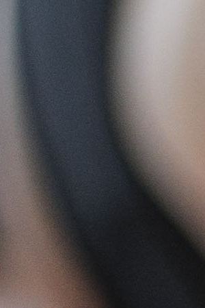 young white blonde girl stretching on a blue mat, with her pink bottle of water