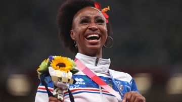 TOKYO, JAPAN - AUGUST 02: Gold medalist, Jasmine Camacho-Quinn of Team Puerto Rico celebrates on the podium during the medal ceremony for the Women’s 100 metres hurdles on day ten of the Tokyo 2020 Olympic Games at Olympic Stadium on August 02, 2021 in Tokyo, Japan.