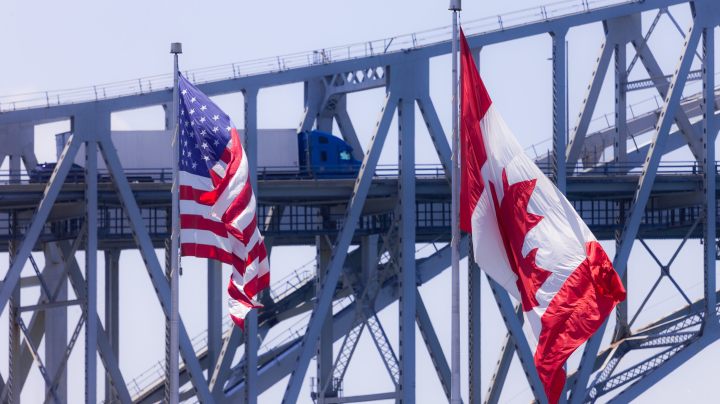 Sarnia, Canada - June 12, 2017. Trucks and cars make their way across the Blue Water Bridge in Sarnia Canada. Opened in 1938 the bridge connects Canada to the United States.